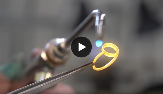 Gold ring with a bezel-set stone