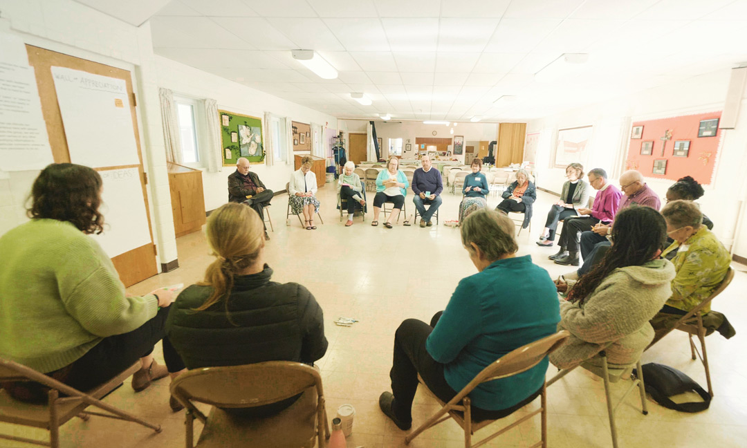A large group of people sitting in a circle in Chadron