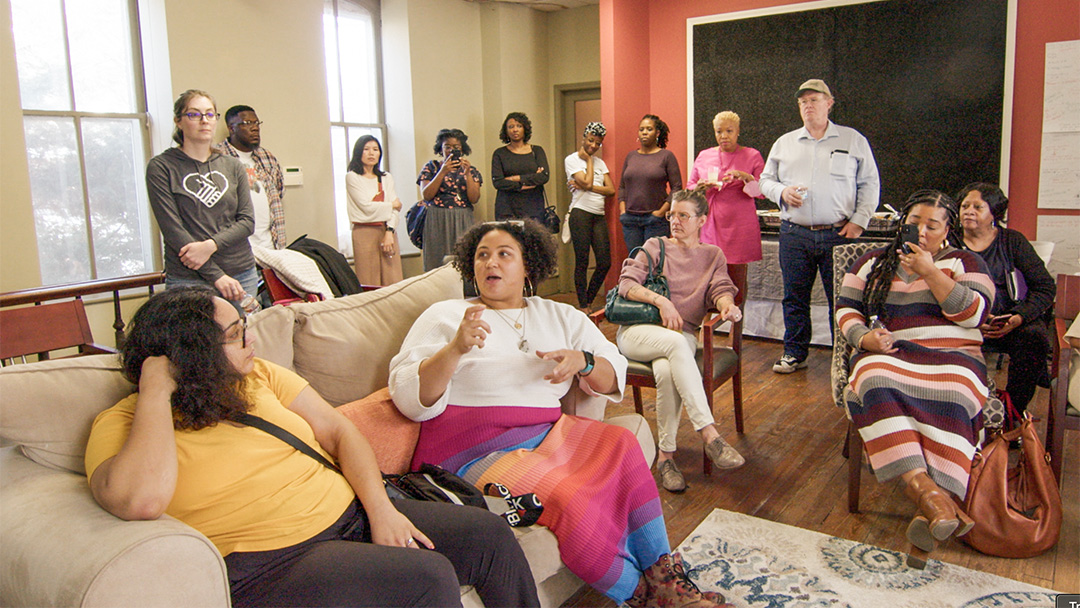 A large group of people in conversation in Memphis