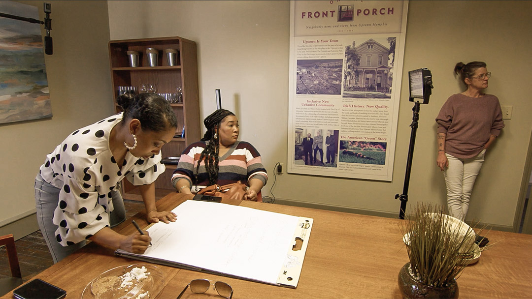 Three women working around a table