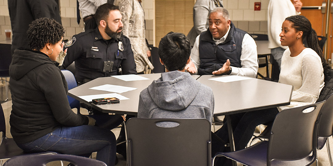 Five people sitting around a table in North Penn