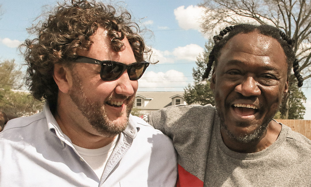 Will Lauderback and a participant smiling