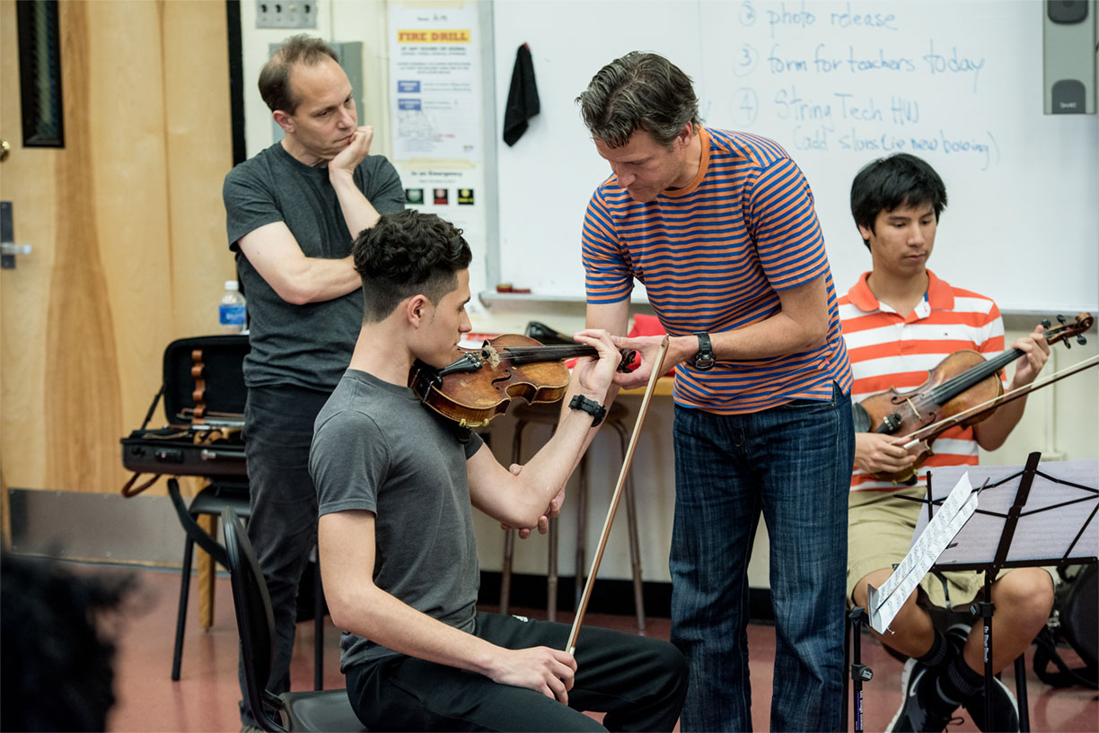 Geoff Nutall of the St Lawrence String Quartet coaching music students at Edward R. Murrow High School in Brooklyn